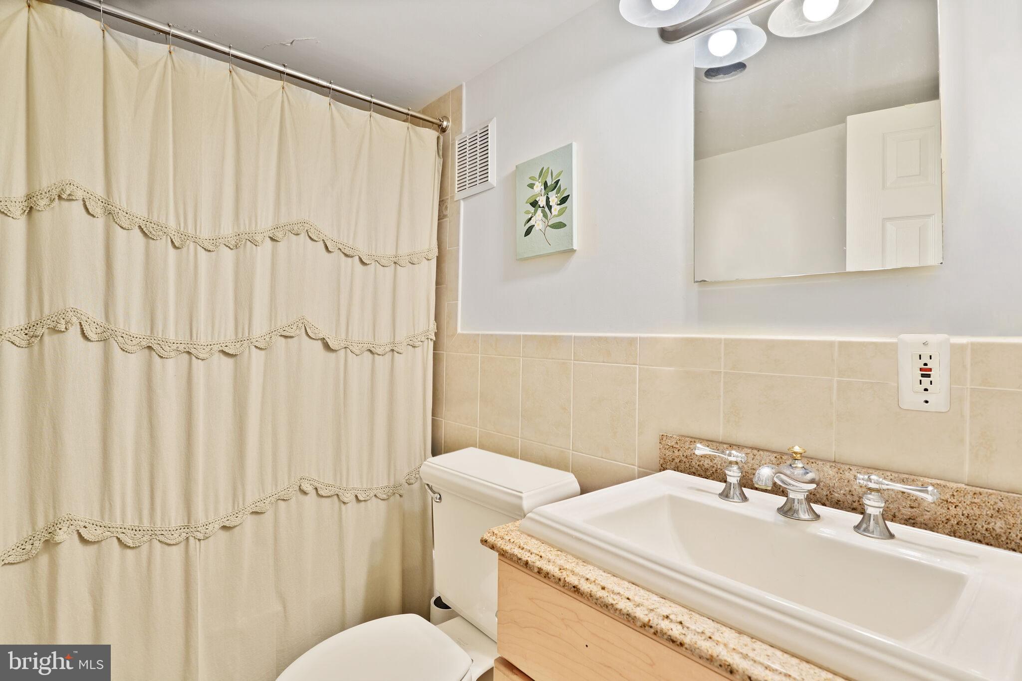 1330 New Hampshire Avenue Northwest, Unit 215 Washington, DC 20036 - Photo 11 of 14 guest bathroom