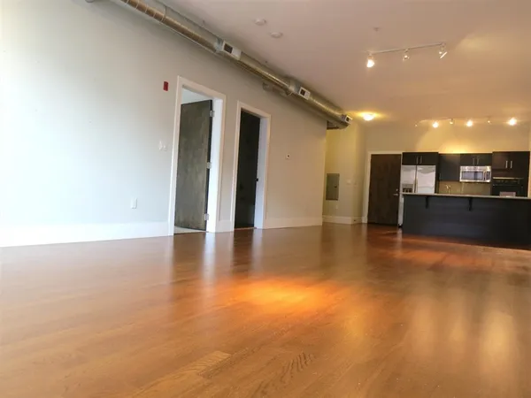 a view of a livingroom with wooden floor