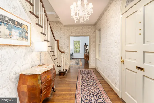 a living room with furniture a rug and a fireplace