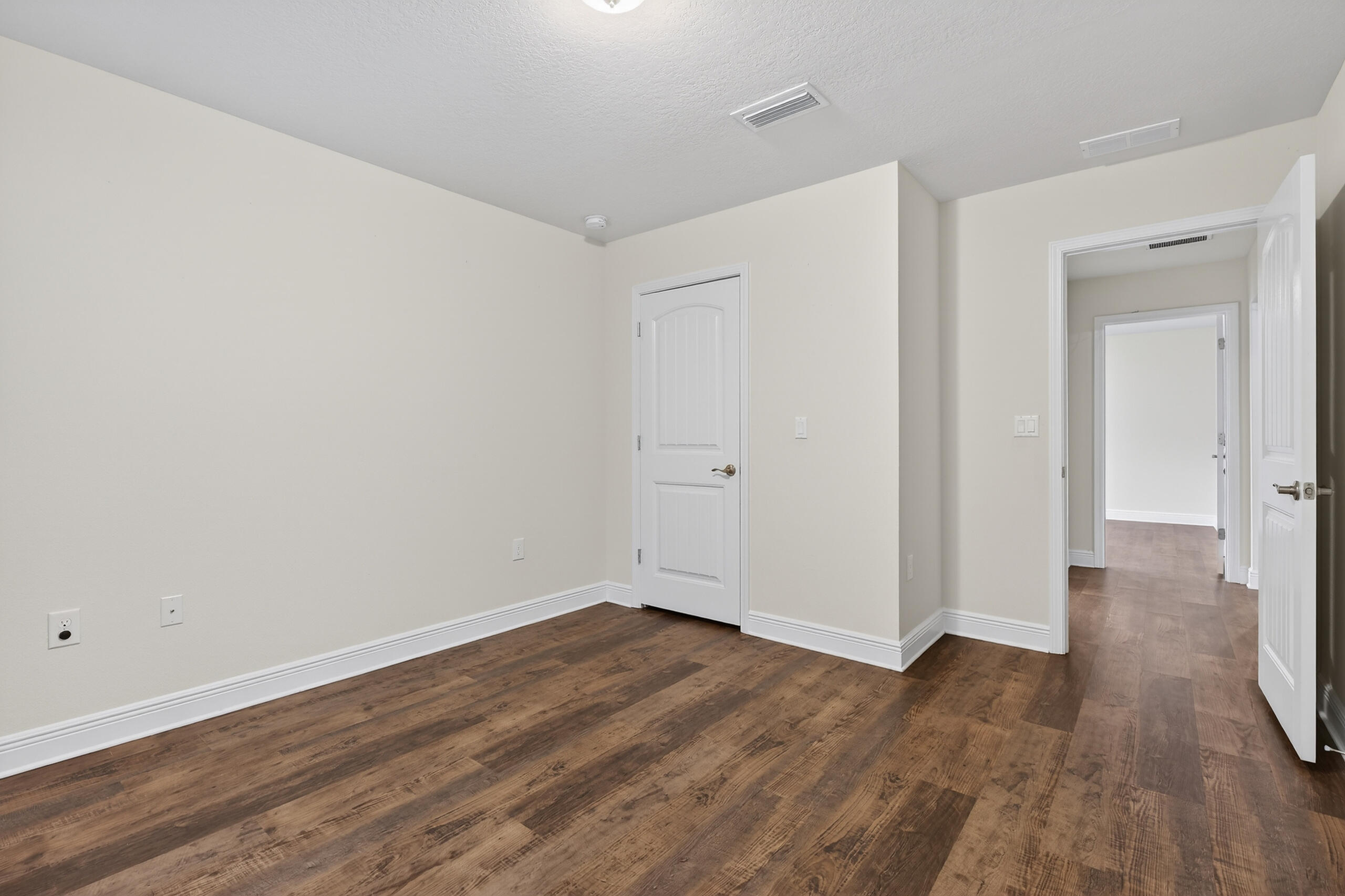 5733 Marigold Loop Crestview, FL 32539 - Photo 27 of 45 a view of a room with wooden floor