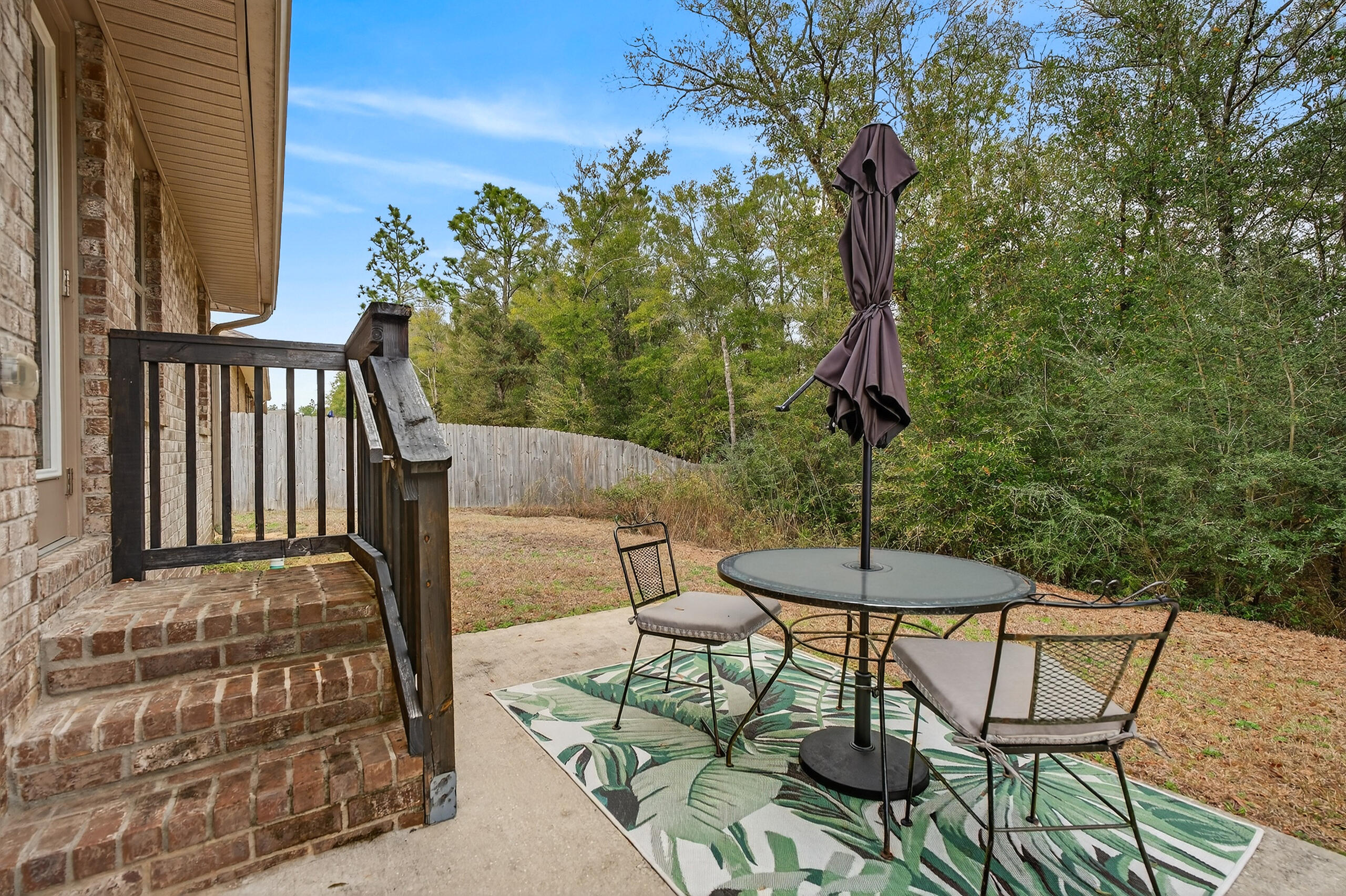 5733 Marigold Loop Crestview, FL 32539 - Photo 40 of 45 a view of a chairs and table in the patio