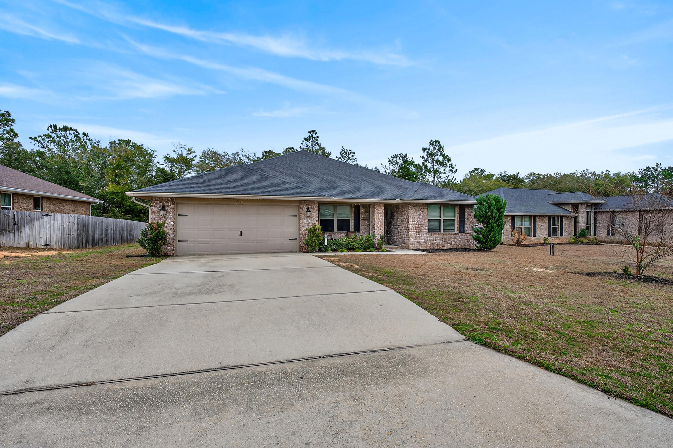 5733 Marigold Loop Crestview, FL 32539 - Photo 4 of 45 front view of a house with a yard