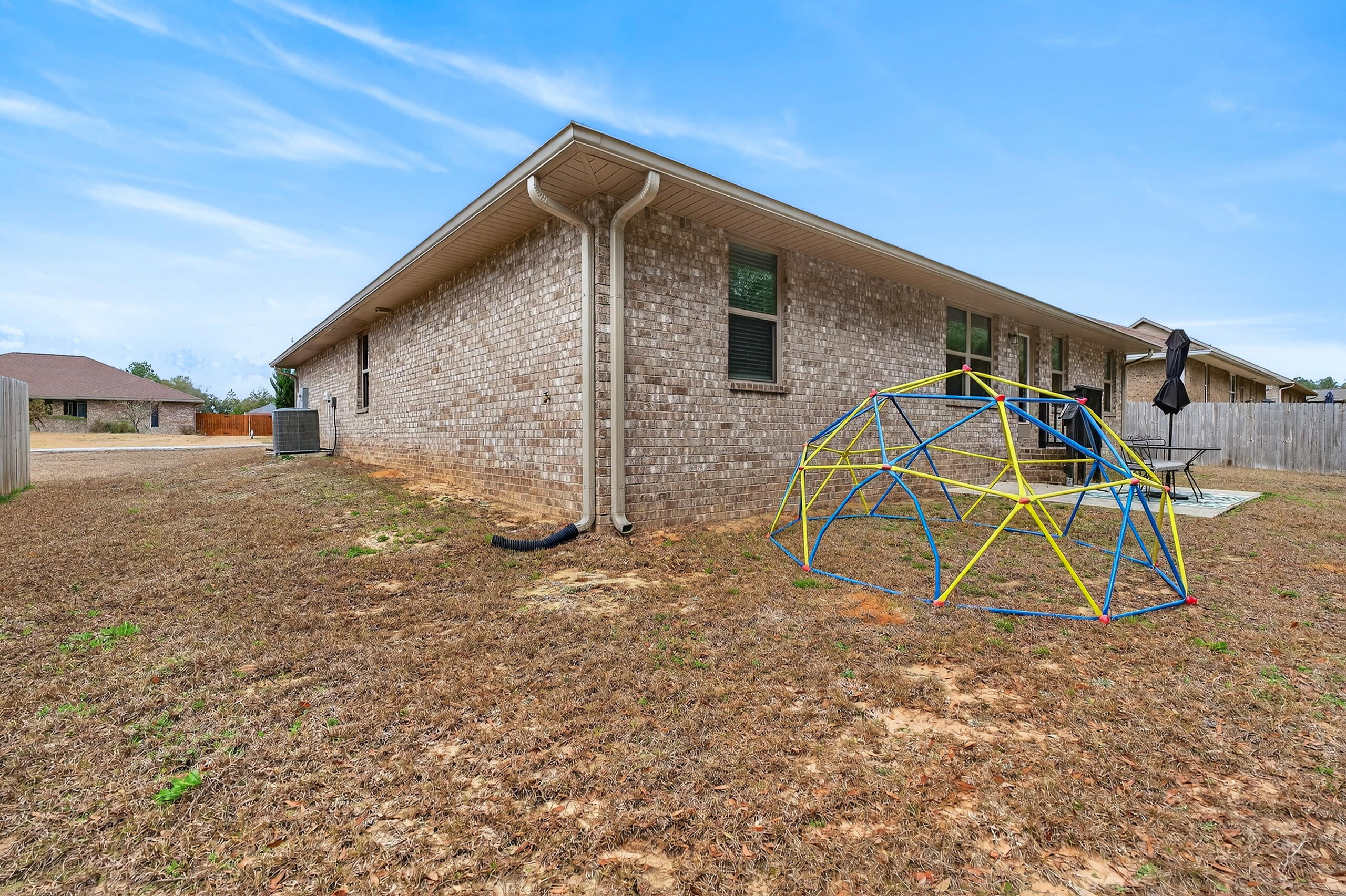 5733 Marigold Loop Crestview, FL 32539 - Photo 44 of 45 a view of a house with a yard