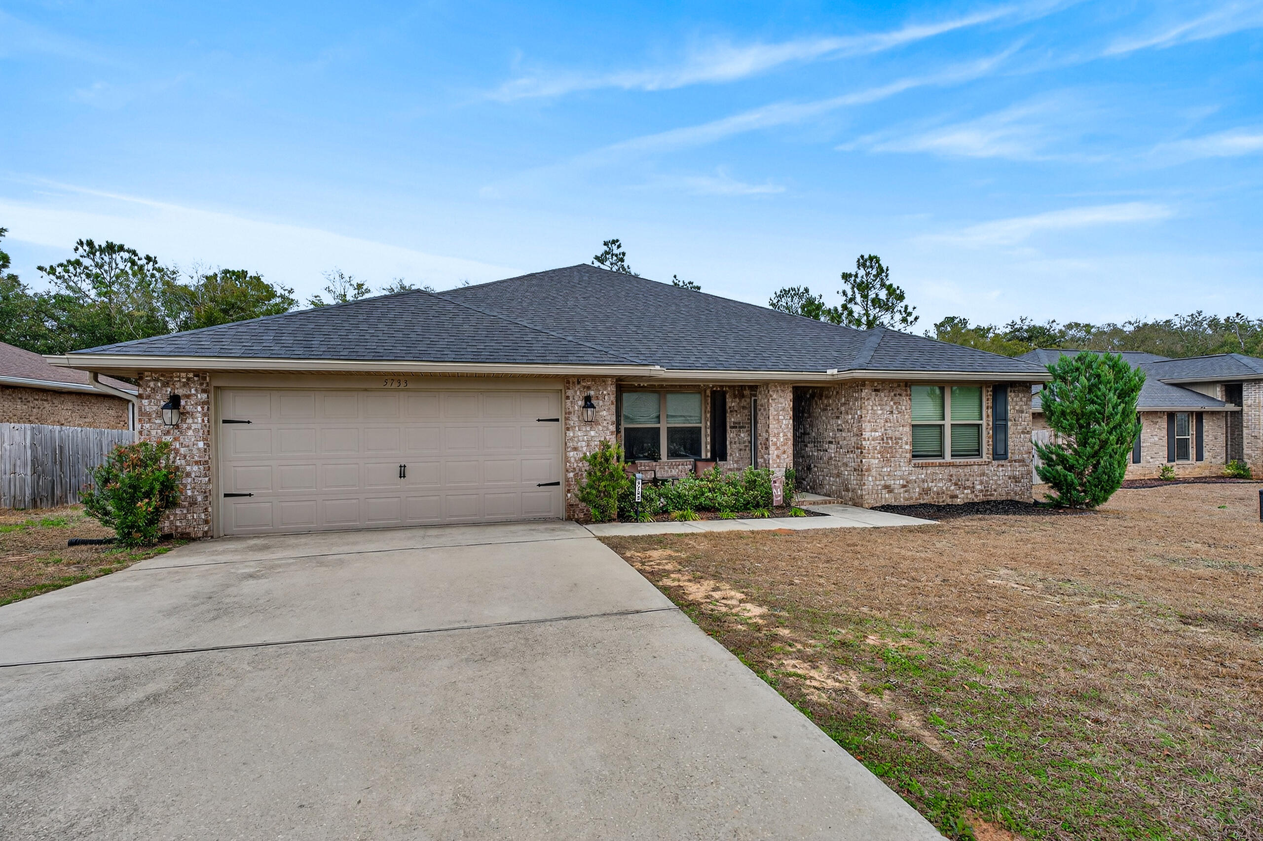 5733 Marigold Loop Crestview, FL 32539 - Photo 5 of 45 front view of a house with a yard