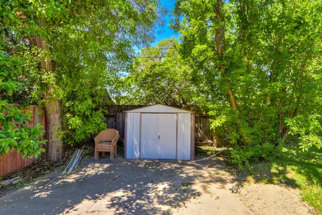 a backyard of a house with seating space
