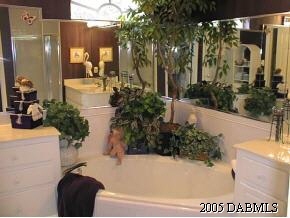 35 Beach Street Ponce Inlet, FL 32127 - Photo 6 of 7 a view of a balcony with potted plants