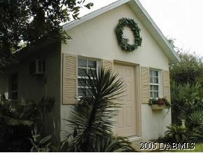 35 Beach Street Ponce Inlet, FL 32127 - Photo 7 of 7 a front view of a house with garden