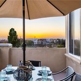 a view of a house with a flower garden