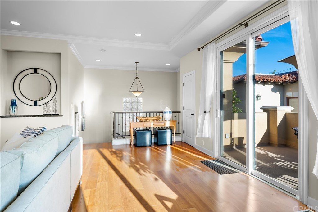 644 10th Street Hermosa Beach, CA 90254 - Photo 15 of 60 a living room with furniture and a fireplace