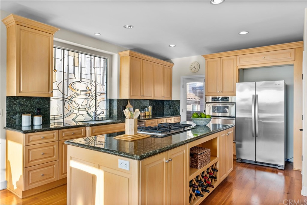 644 10th Street Hermosa Beach, CA 90254 - Photo 18 of 60 a kitchen with stainless steel appliances granite countertop a stove and a sink