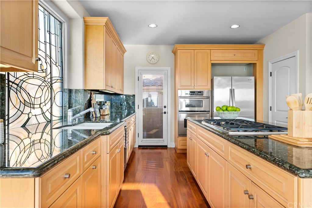 644 10th Street Hermosa Beach, CA 90254 - Photo 19 of 60 a view of a patio with a table and chairs