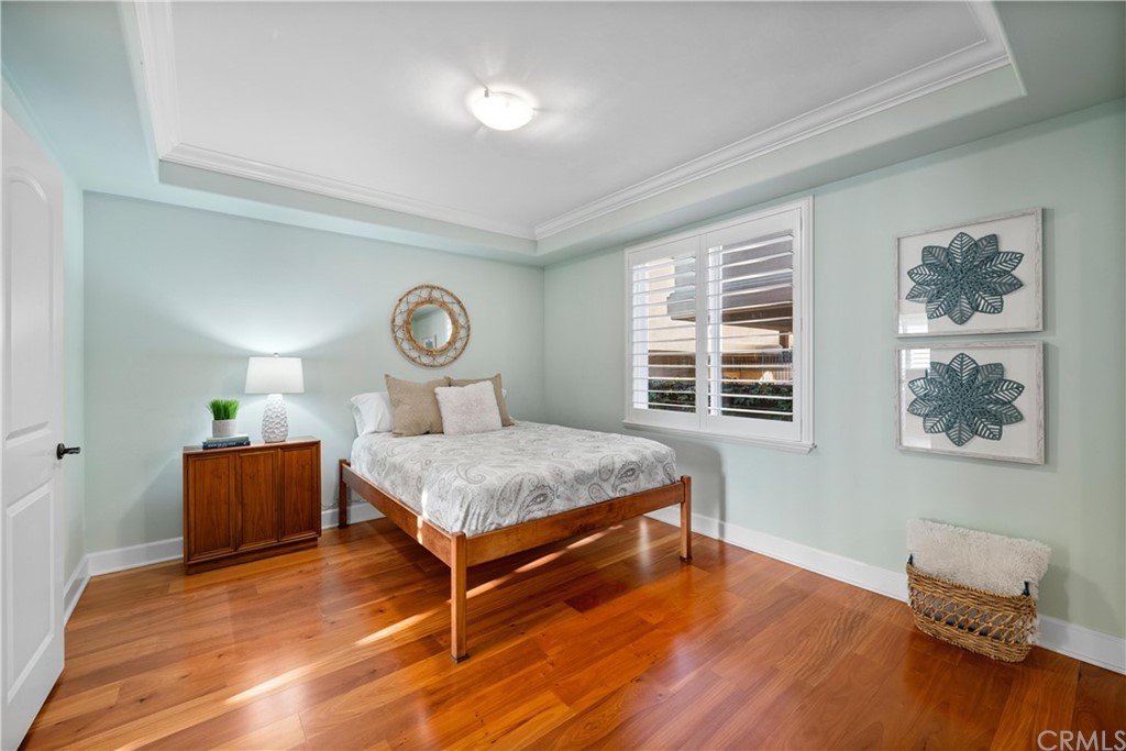 644 10th Street Hermosa Beach, CA 90254 - Photo 26 of 60 a bedroom with a large bed and wooden floor