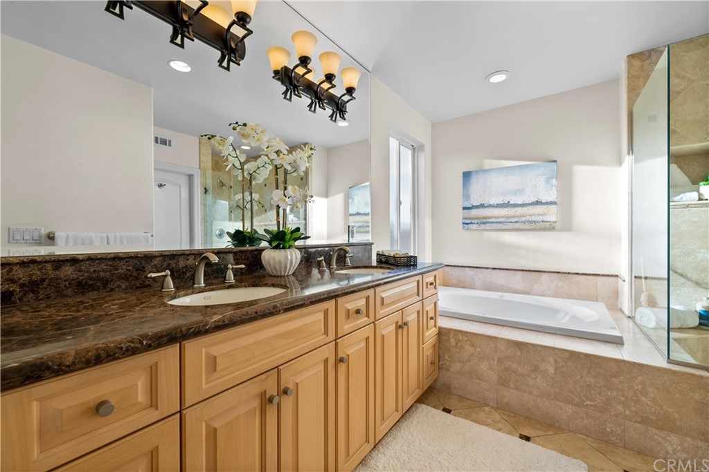 644 10th Street Hermosa Beach, CA 90254 - Photo 34 of 60 a bathroom with a sink a vanity and a mirror
