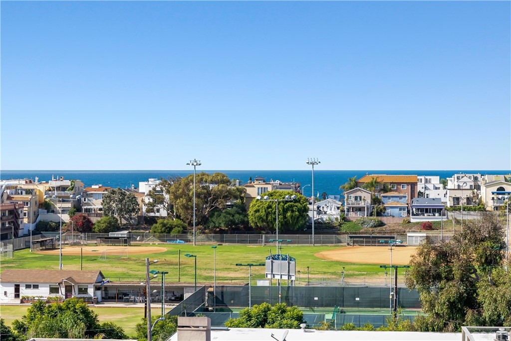 644 10th Street Hermosa Beach, CA 90254 - Photo 49 of 60 a bathroom with a sink a toilet a large mirror and shower
