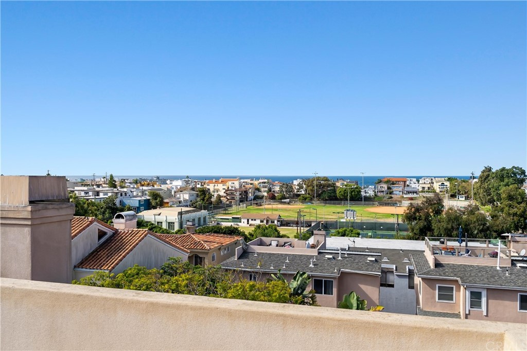 644 10th Street Hermosa Beach, CA 90254 - Photo 51 of 60 a bedroom with a large bed and wooden floor