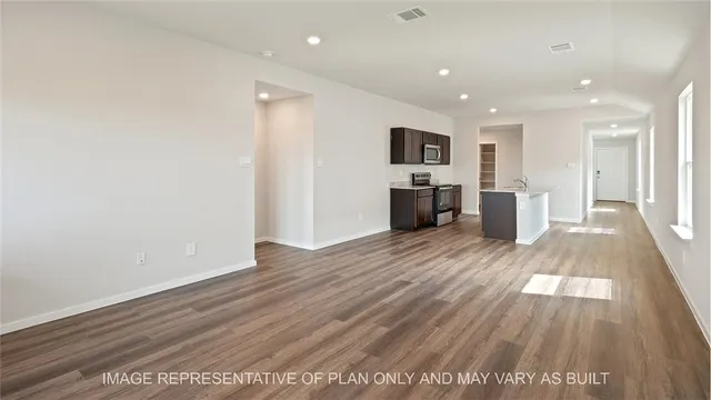 a view of a living room with wooden floor