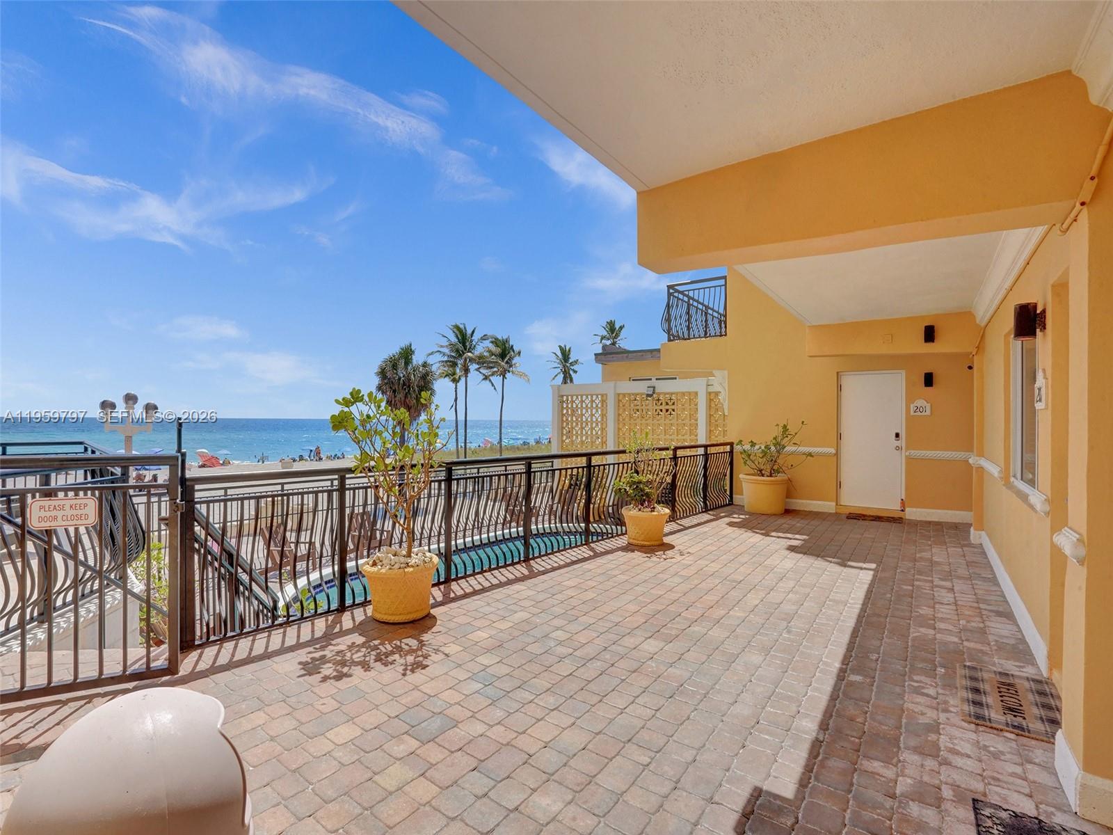 1815 North Surf Road, Unit 202 Hollywood, FL 33019 - Photo 24 of 32 a view of a balcony with chairs