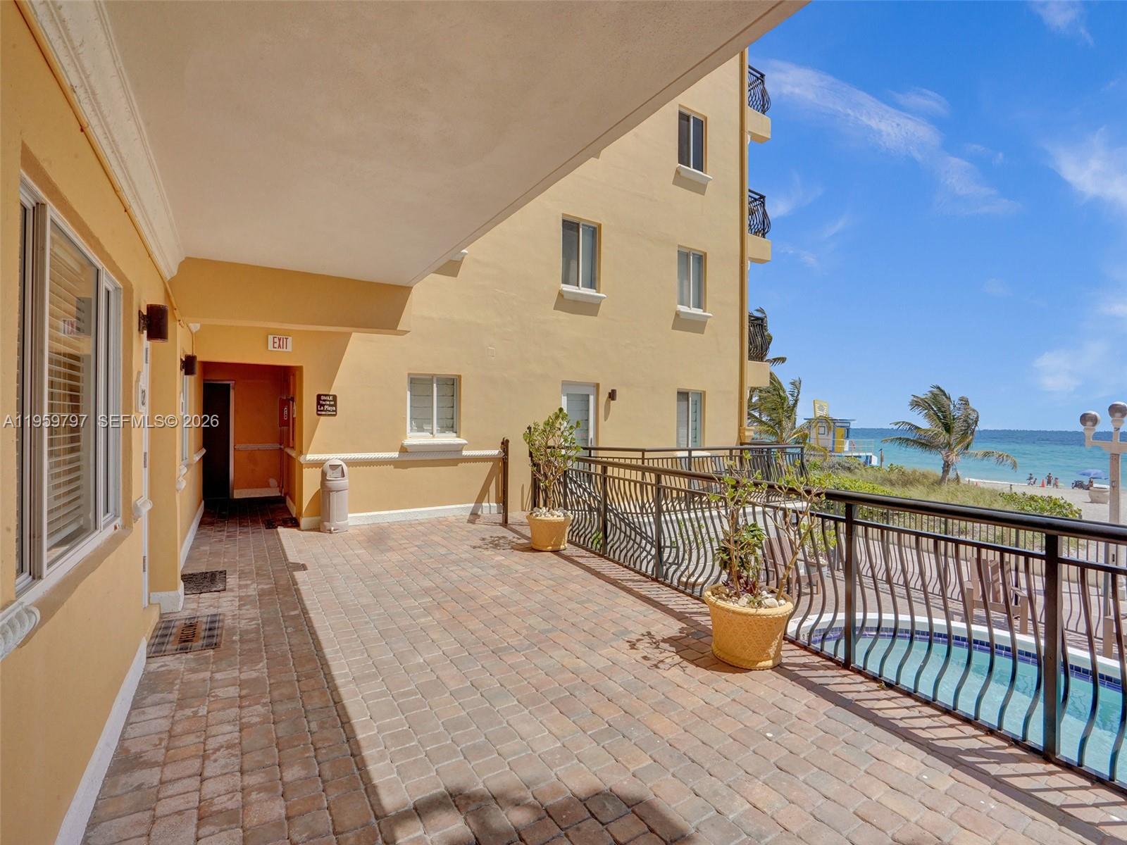 1815 North Surf Road, Unit 202 Hollywood, FL 33019 - Photo 25 of 32 a view of a balcony with chairs