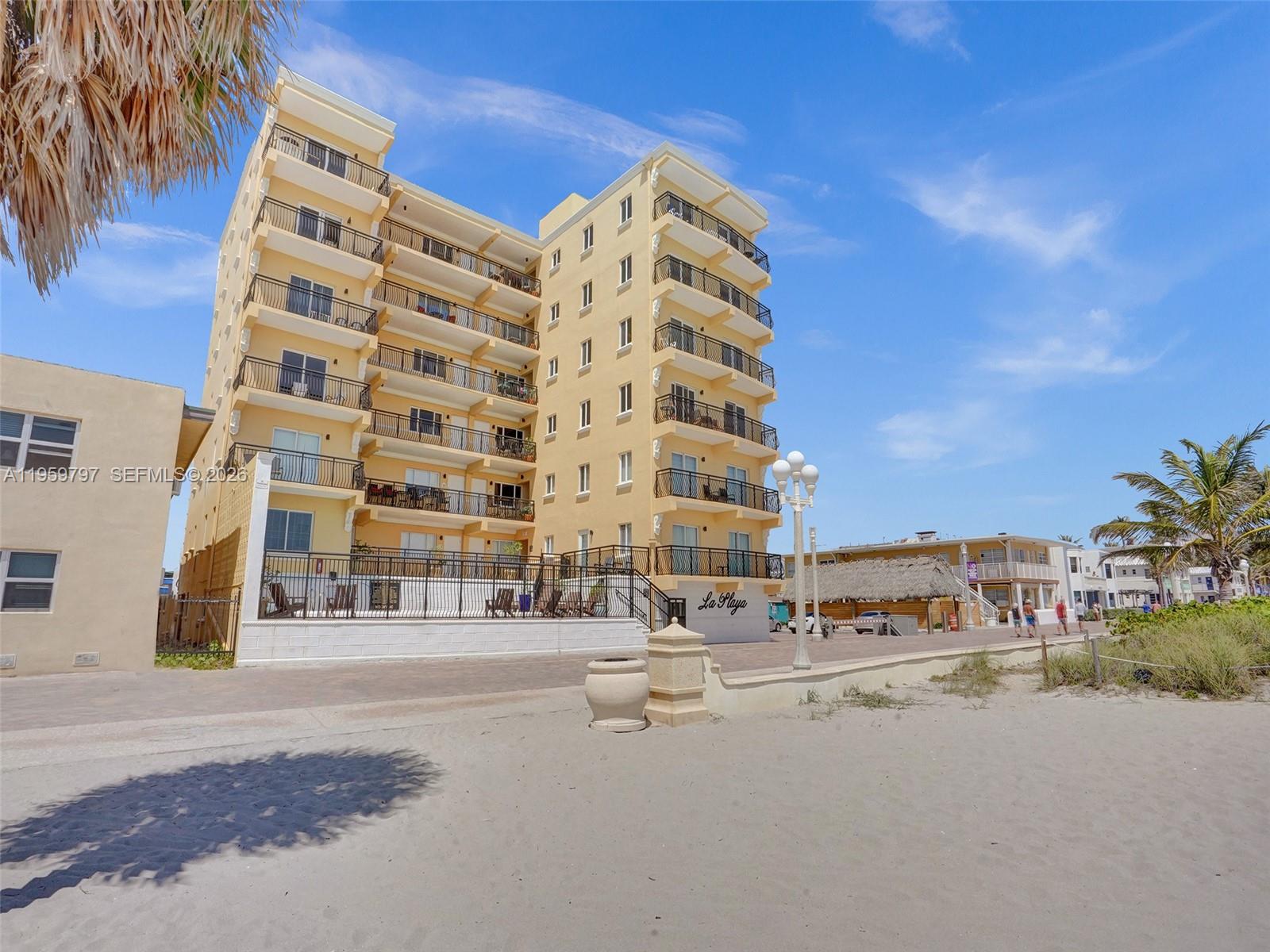 1815 North Surf Road, Unit 202 Hollywood, FL 33019 - Photo 31 of 32 a view of building with parking space