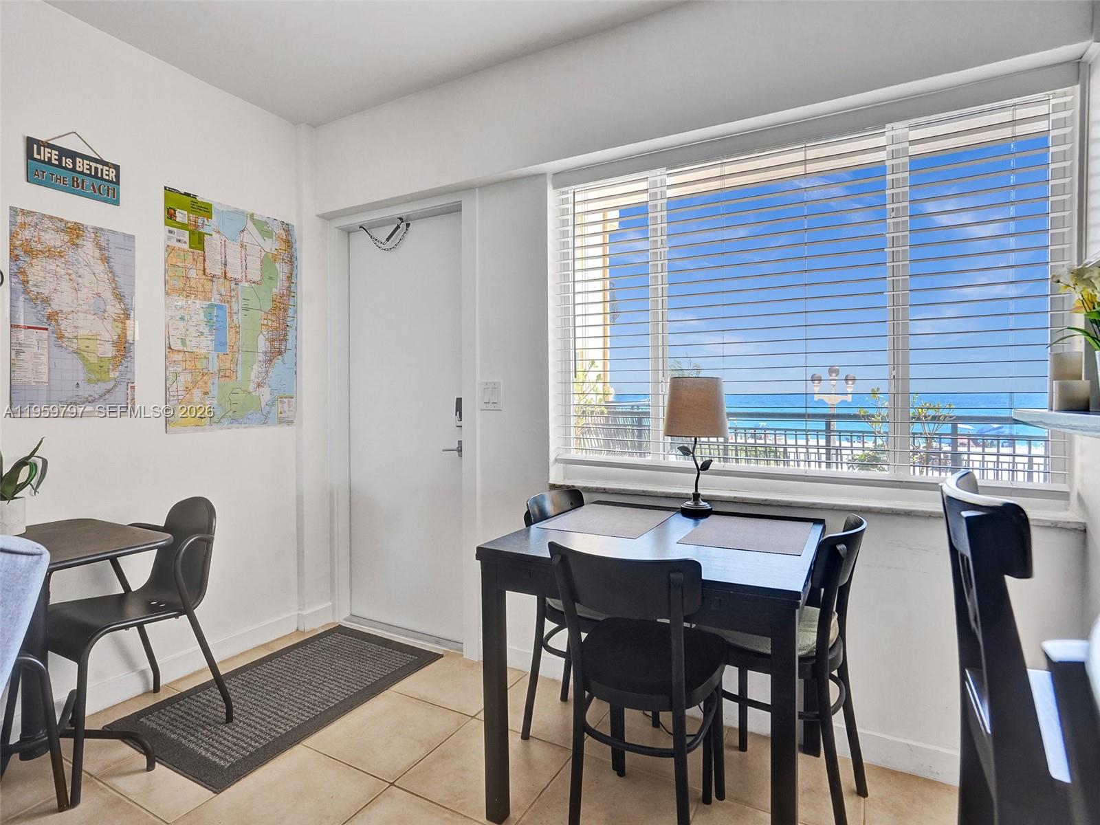 1815 North Surf Road, Unit 202 Hollywood, FL 33019 - Photo 10 of 32 a dining room with a table and chairs