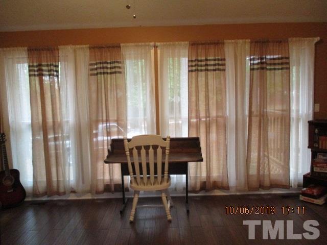 133 Tant Road Zebulon, NC 27597 - Photo 14 of 18 a view of a livingroom with furniture window and wooden floor