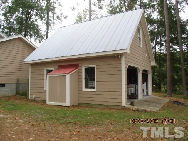 133 Tant Road Zebulon, NC 27597 - Photo 3 of 18 a front view of a house with a yard