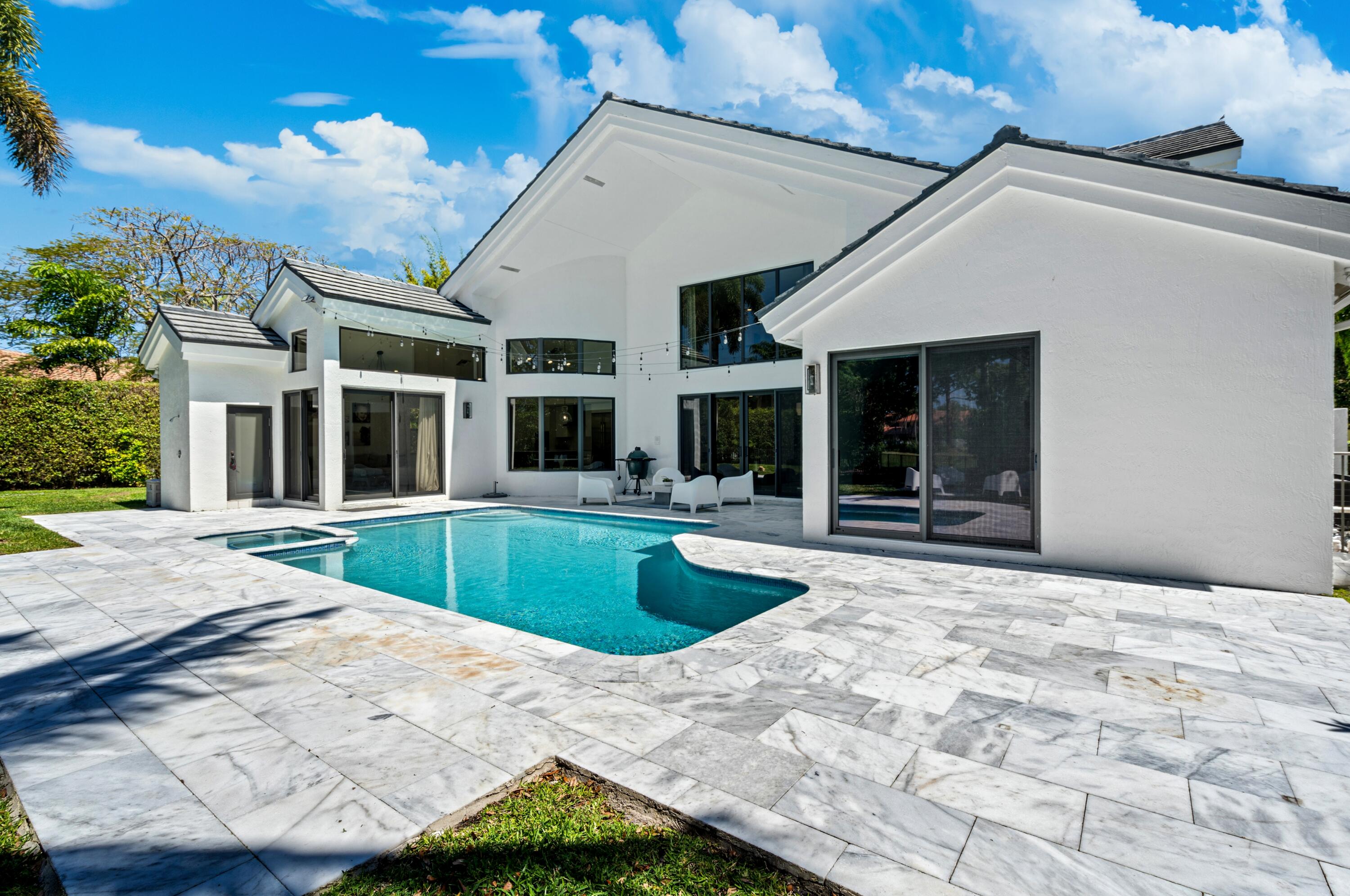 3098 Northwest 60th Street Boca Raton, FL 33496 - Photo 26 of 30 a view of a house with roof and sitting area