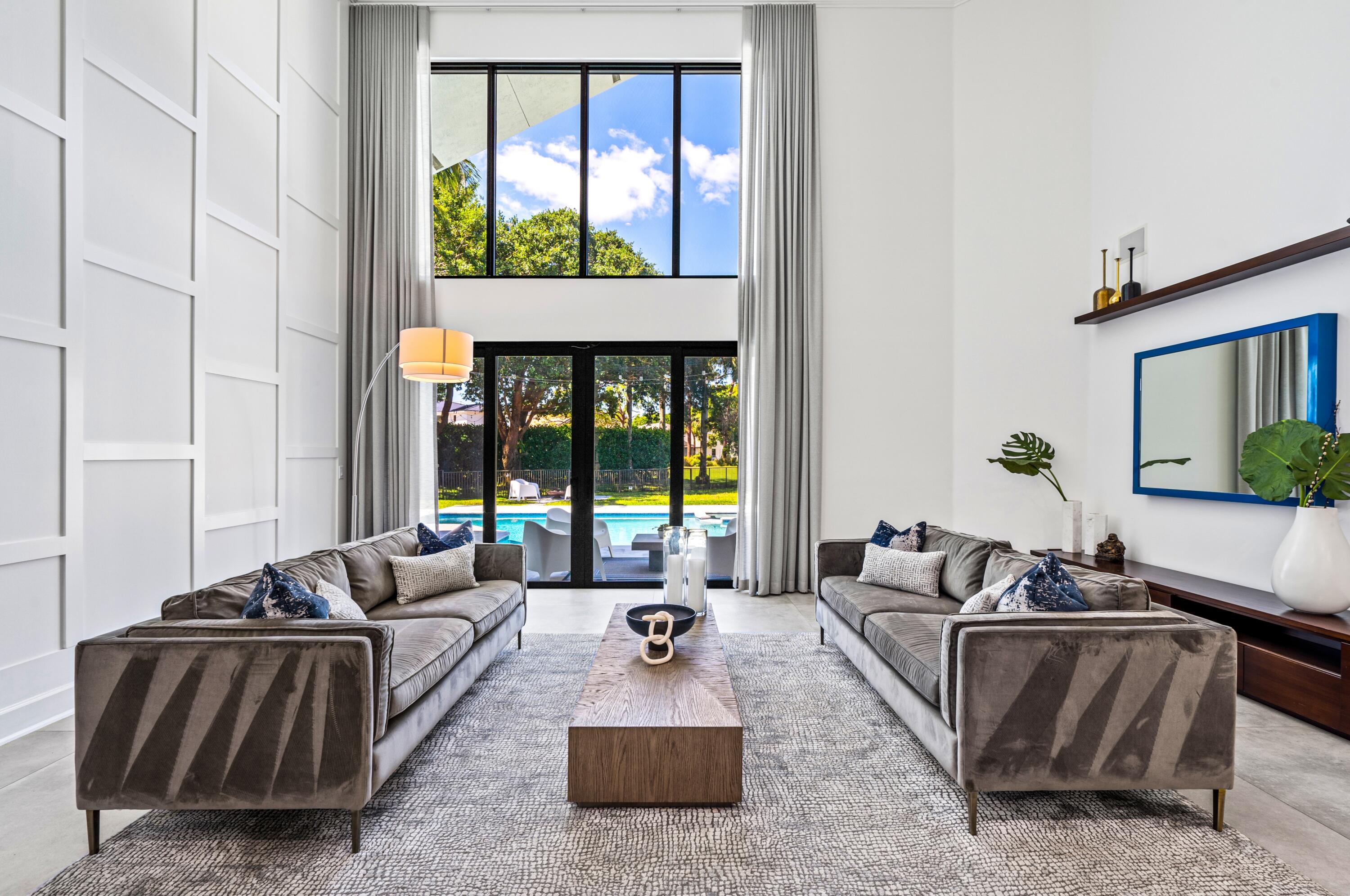 3098 Northwest 60th Street Boca Raton, FL 33496 - Photo 4 of 30 a living room with furniture and a large window