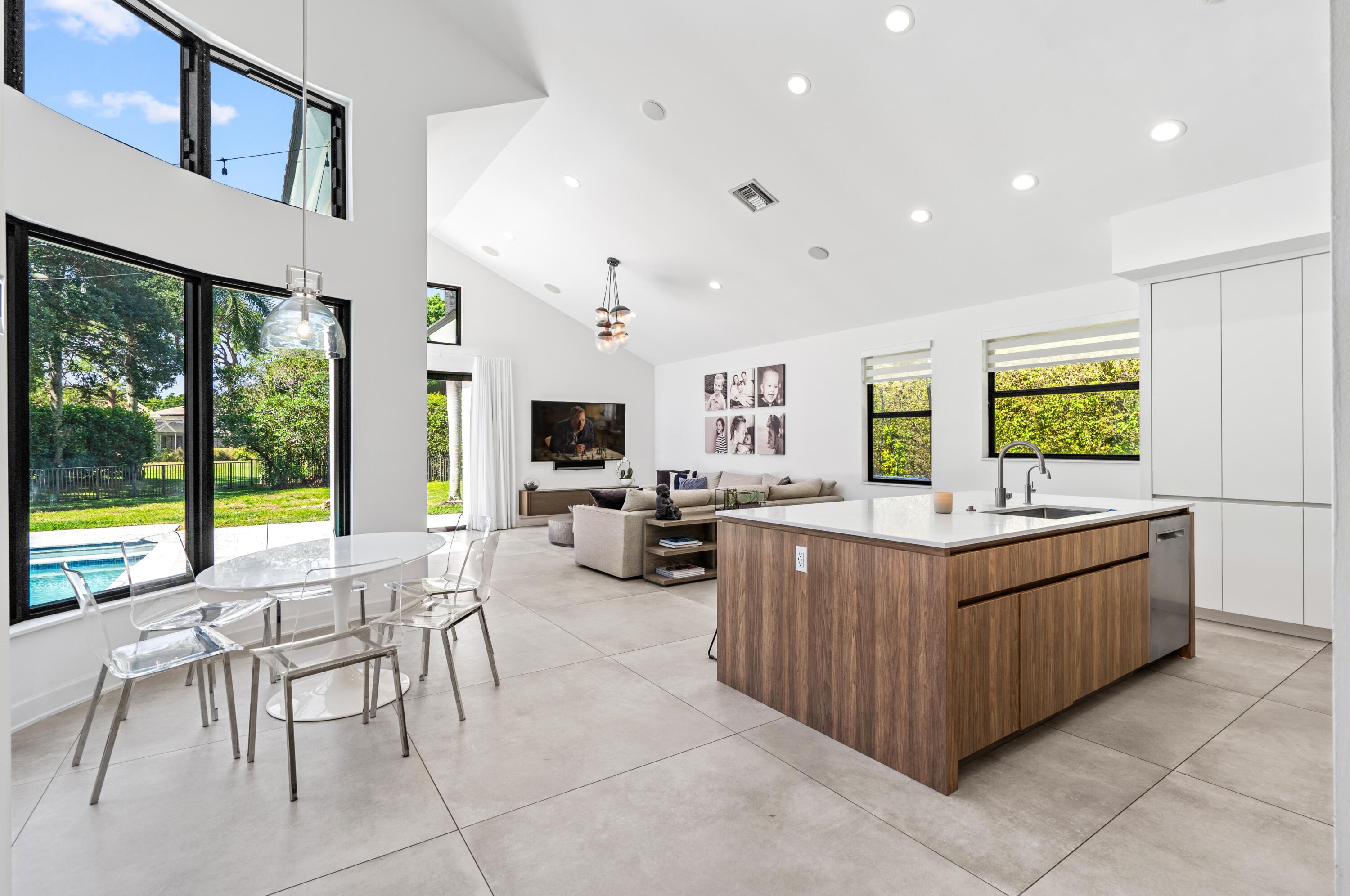 3098 Northwest 60th Street Boca Raton, FL 33496 - Photo 10 of 30 a living room with furniture and a flat screen tv