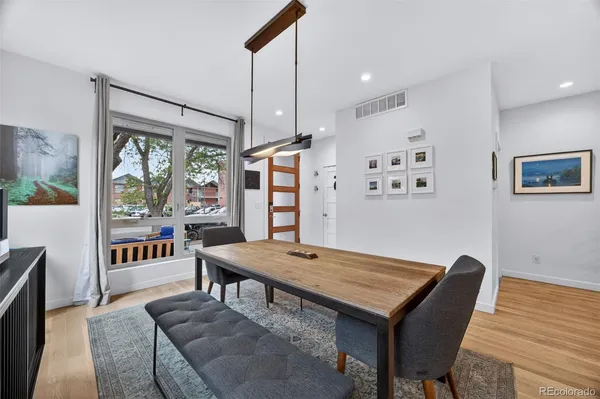 a view of a dining room with furniture window and wooden floor
