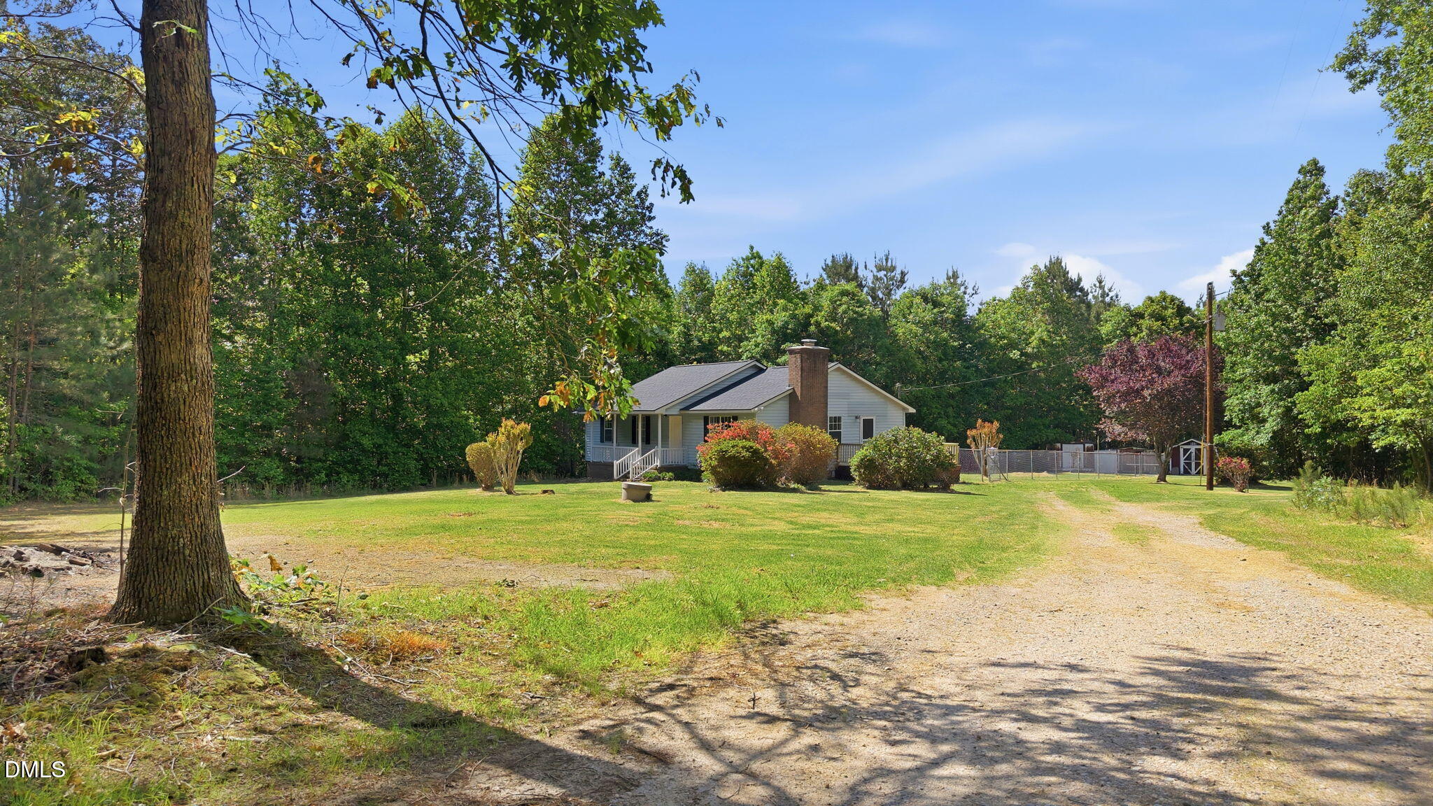 3602 Harrison Road Castalia, NC 27816 - Photo 4 of 48 a yellow and red house sitting in middle of the forest