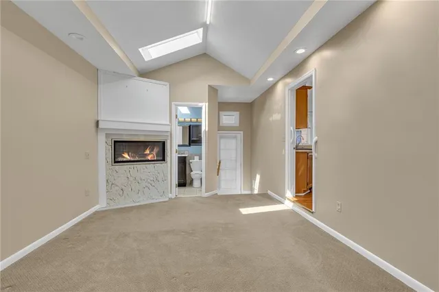 a view of an empty room and fire place