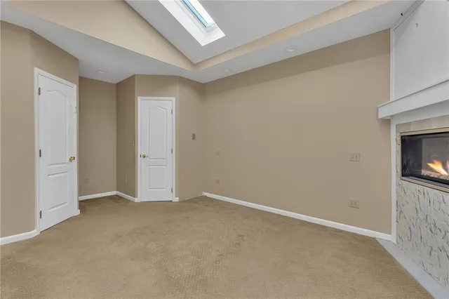 a view of an empty room and fire place