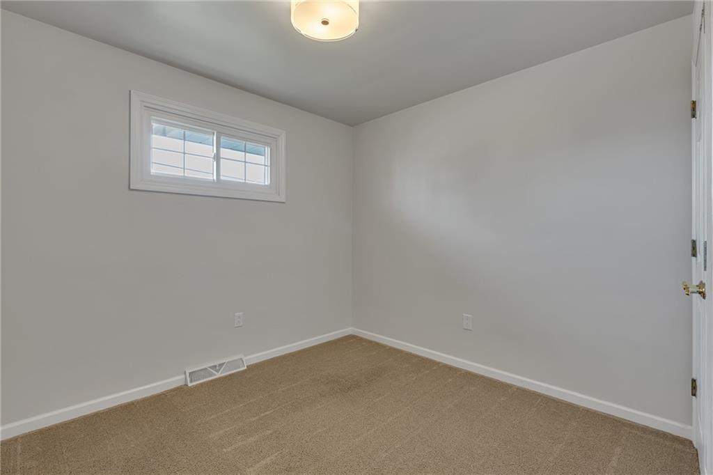 1044 Charles Street Monaca, PA 15061 - Photo 17 of 31 an empty room with a window