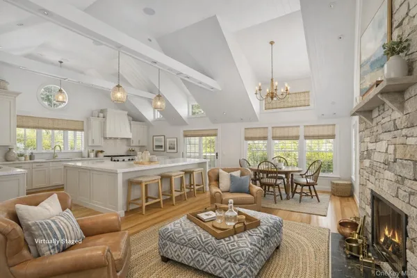 a living room with furniture fireplace and a table