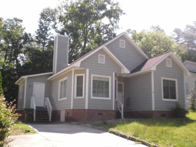 2428 Calvert Drive Raleigh, NC 27610 - Photo 1 of 12 a front view of a house with a garden and yard
