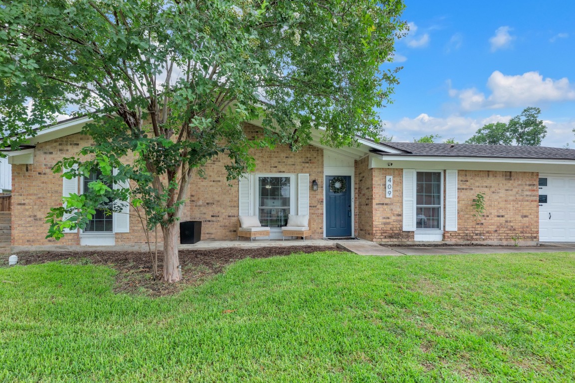 409 White Wing Way Round Rock, TX 78664 - Photo 1 of 1 front view of a house with a yard