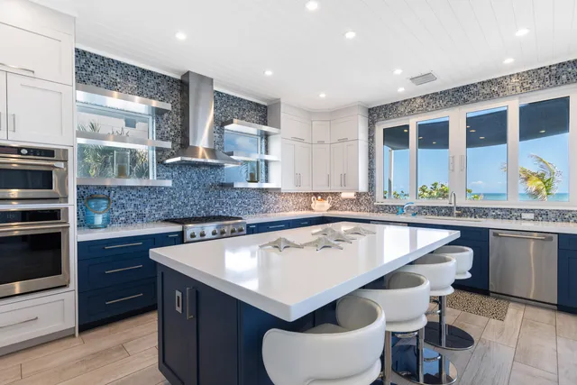 a kitchen with a stove a refrigerator and a sink