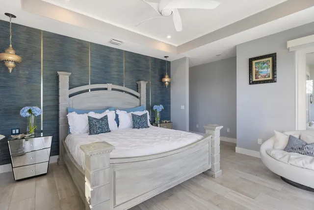 a bedroom with a large bed and a couch