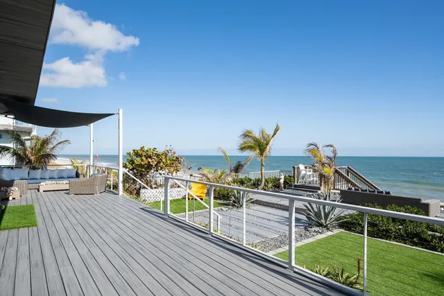 a view of a balcony with chairs