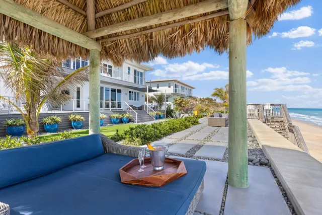 a view of a patio with a table and chairs