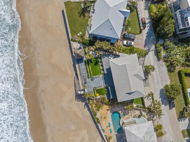 an aerial view of a house with outdoor space