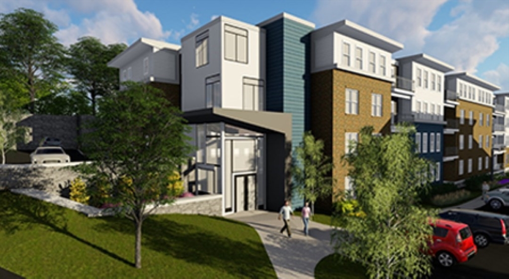 57 Mill Street, Unit 420 Woburn, MA 01801 - Photo 1 of 5 a view of a building with many windows