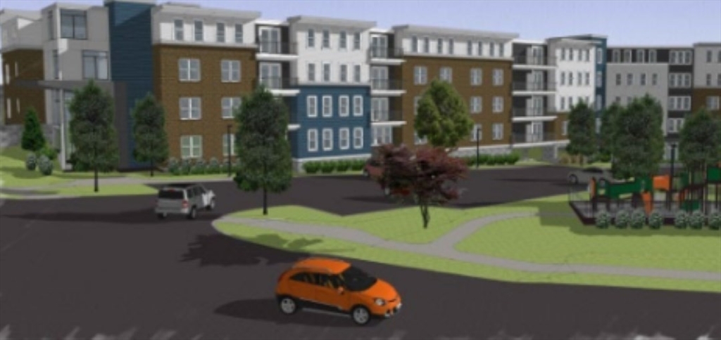 57 Mill Street, Unit 420 Woburn, MA 01801 - Photo 2 of 5 a small pool with a table and chairs