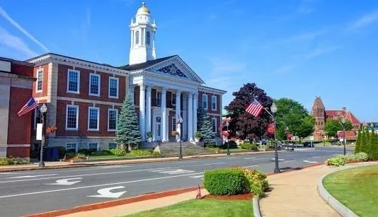 a front view of building with yard