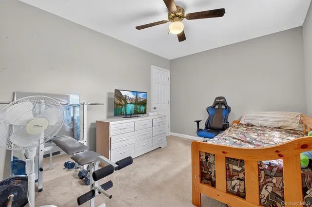 a bed room with furniture and a wooden floor