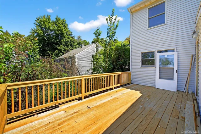 a view of balcony with wooden floor