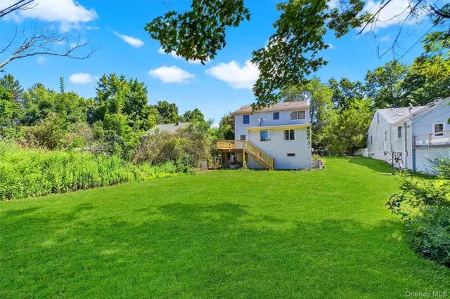 a view of a house with a big yard