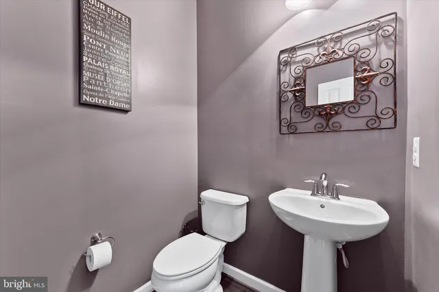 a living room with fireplace furniture and decor