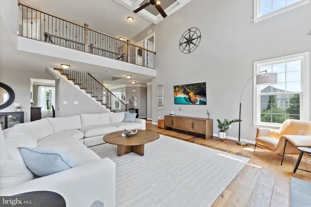 a kitchen with stainless steel appliances granite countertop white cabinets granite counter tops and a stove